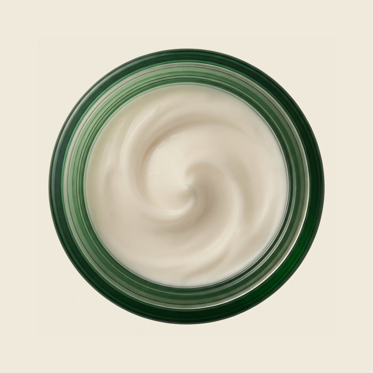 The open jar seen from above, showing the thick off-white cream texture