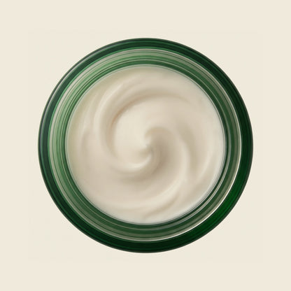 The open jar seen from above, showing the thick off-white cream texture