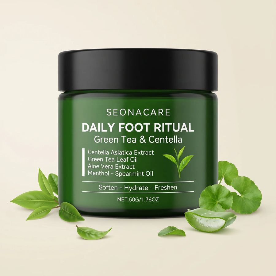 The jar surrounded by fresh green tea leaves, centella asiatica leaves and cut aloe vera